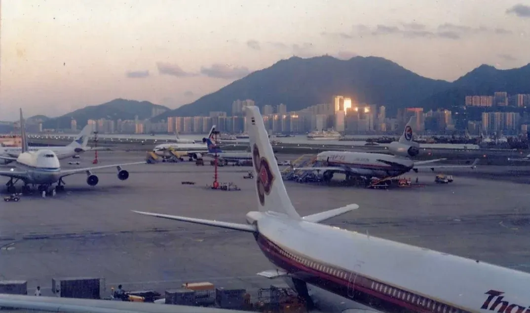 Busy Kai Tak Airport, Hong Kong at sunset, 1996